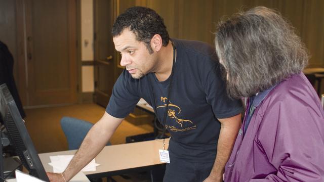 Two people working at a computer