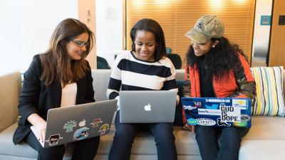 three women on their laptops