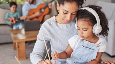 A mother and daughter sitting together doing an art project