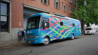 The Multnomah County Library Mobile Library parked on a street.