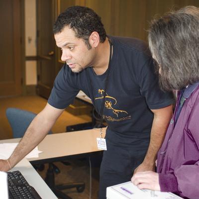 Two people working at a computer