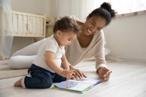 A mother reading a book to her child