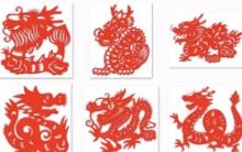 Six red paper sculptures on white background