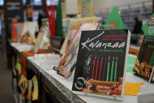 A book on Kwanzaa on a library counter