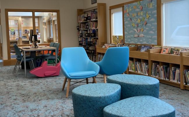 Fairview Library's children's area with books, shelving and soft seating.