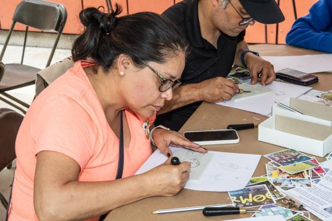 Two community members work on fun design ideas for St. Johns Library