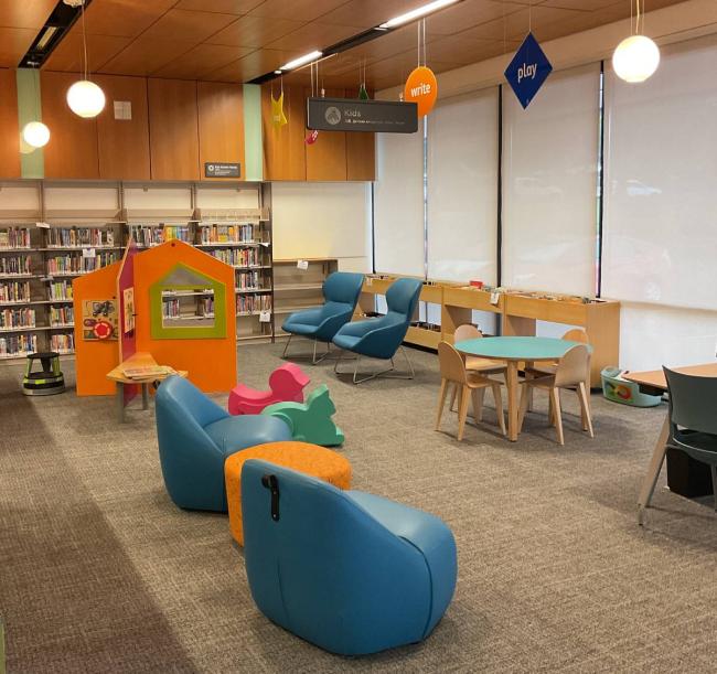 Troutdale's new kids area with soft seating and animal chairs. 